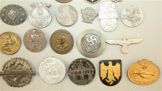 A large collection of various German Third Reich badges,